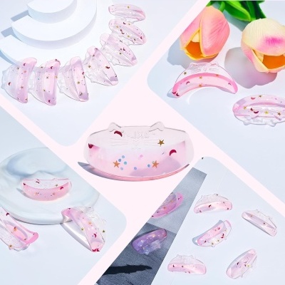 Grampos de cabelo rosa translúcidos com estrelas e luas, em forma de rosto de gato