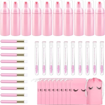 Conjunto cor-de-rosa para extensões de pestanas com frascos, aplicadores, escovas, saquetas e saco.