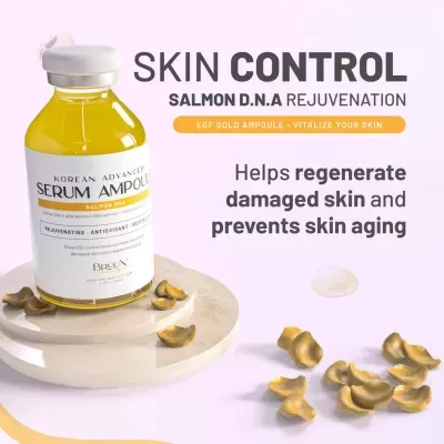 Frasco vidro serum ampoule com tampa branca sobre base mármore com pétalas secas