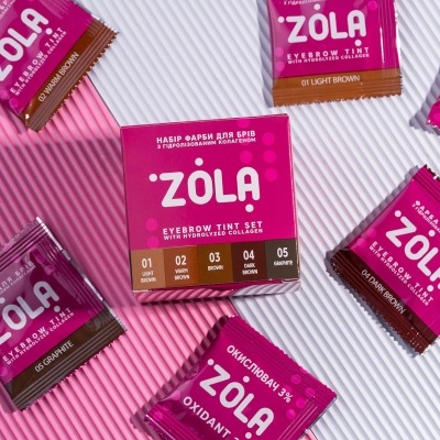 Conjunto tintura sobrancelhas ZOLA com várias amostras coloridas e embalagem rosa e castanha