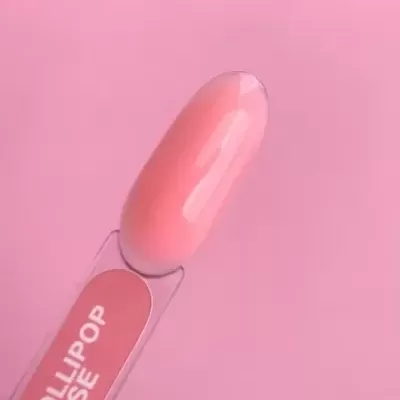 Vidro transparente com amostra de esmalte rosa claro e texto LOLIPOP BASE