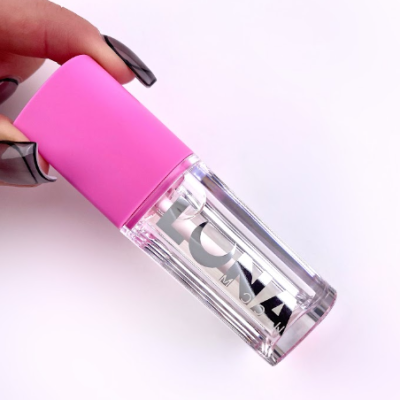 Frasco cosmético transparente com tampa rosa e rótulo LUNA