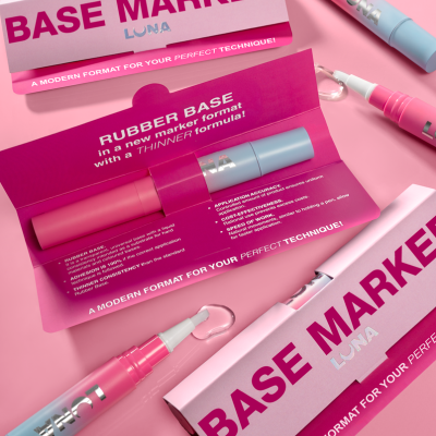 Conjunto de marcadores BASE MARKER LUNA com embalagem rosa, texto em inglês, design moderno e componentes azuis e rosa.