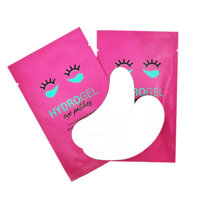 Pacotes rosa de Hydrogel eye patches com formas de hidrogel brancas à frente