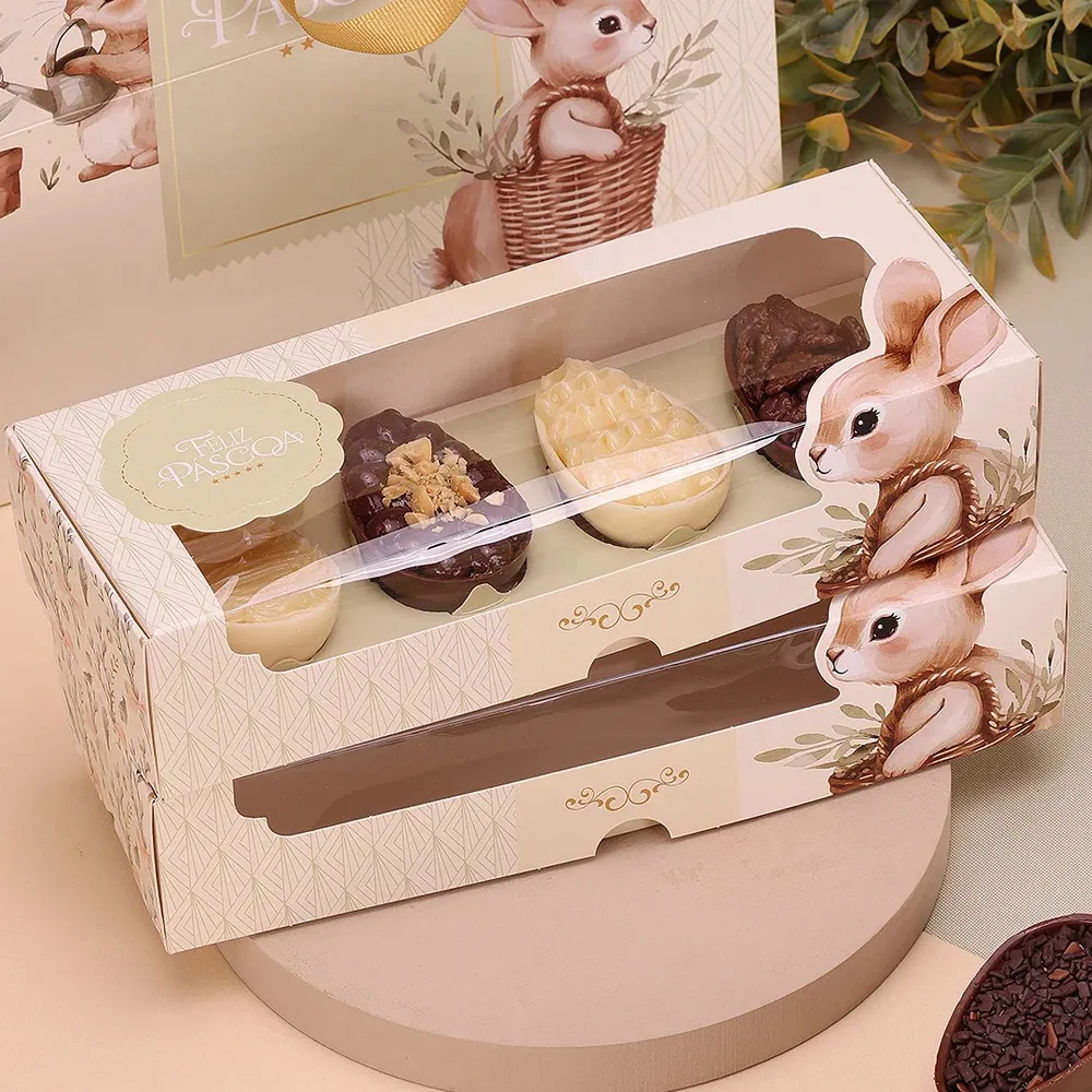 Caixa de chocolates de Páscoa decorada com coelhos e texto FELIZ PÁSCOA
