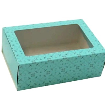Caixa retangular azul clara com padrão floral e tampa transparente