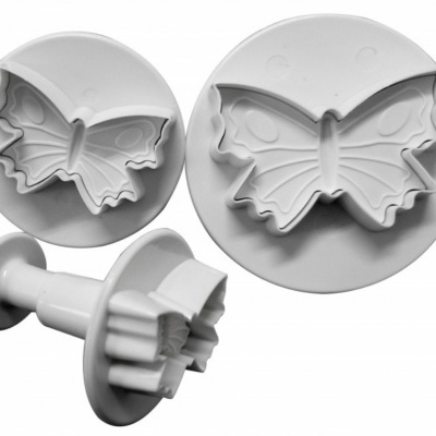 Cortadores plásticos brancos em forma de borboleta