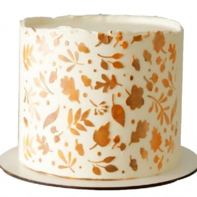 Bolo cilíndrico branco com flores douradas estampadas e base branca