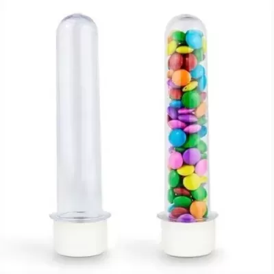 Recipientes cilíndricos transparentes, um vazio e outro com confetis coloridos