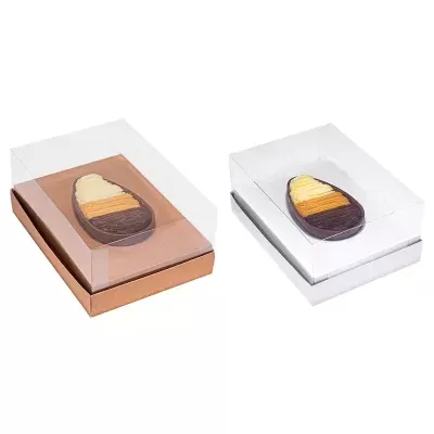 Dois ovos de chocolate em caixas transparentes com bases castanha e branca