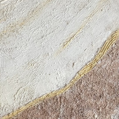 Textura de parede em tons bege e ocre com relevo irregular e divisão diagonal