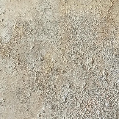 Superfície texturada bege claro com irregularidades