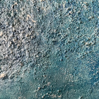 Superfície rugosa azul e branca com textura irregular