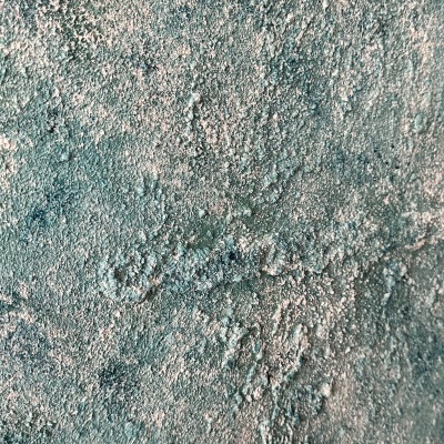 Superfície texturada azul esverdeada com detalhes esbranquiçados