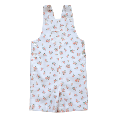 Macacão infantil branco com flores cor de laranja e verde e alças ajustáveis