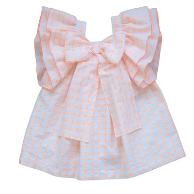 Vestido infantil branco com padrão laranja e gola com volantes