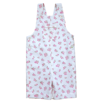 Jardineira branca com flores cor-de-rosa para criança