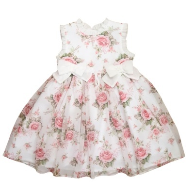 Vestido de criança branco com padrão floral e laços brancos