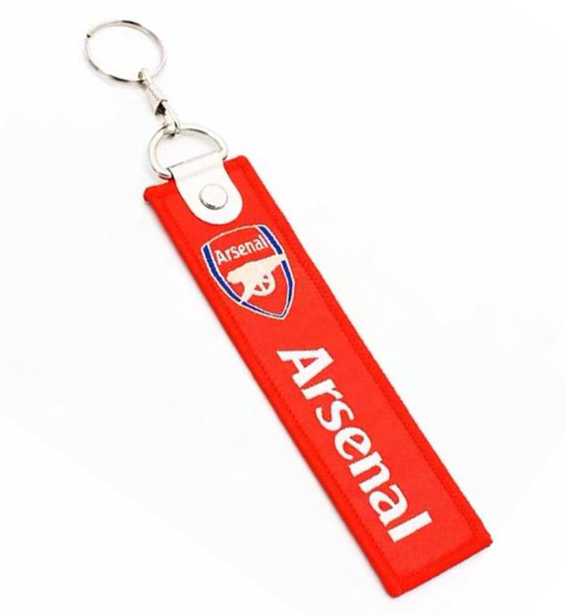 Chaveiro vermelho com logótipo e texto Arsenal