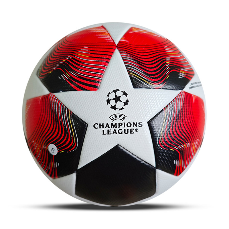 Bola de futebol UEFA Champions League branca, preta e vermelha com padrão de estrelas.