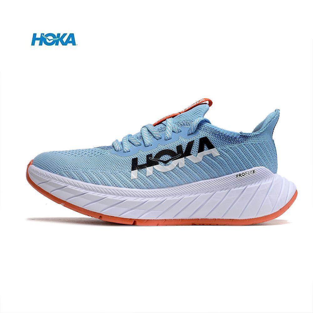 Sapatilha desportiva azul claro HOKA com sola branca e base laranja
