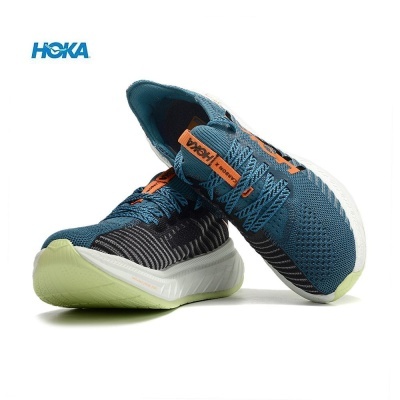 Ténis de corrida HOKA azul escuro com detalhes laranja e sola verde clara