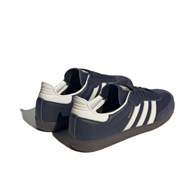 Sapatilhas Adidas azul escuro e branco com sola castanha e texto SAMBA em dourado