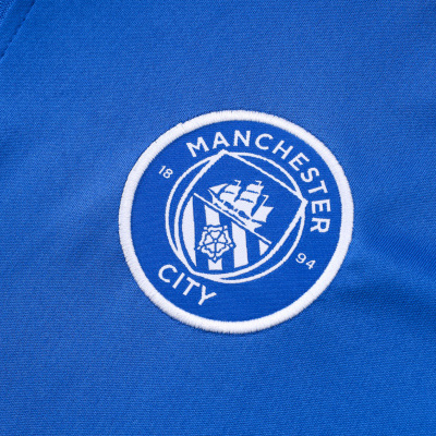 Logótipo bordado do Manchester City em tecido azul