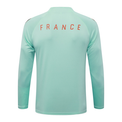 T-shirt desportiva de manga comprida verde claro com texto FRANCE em laranja nas costas