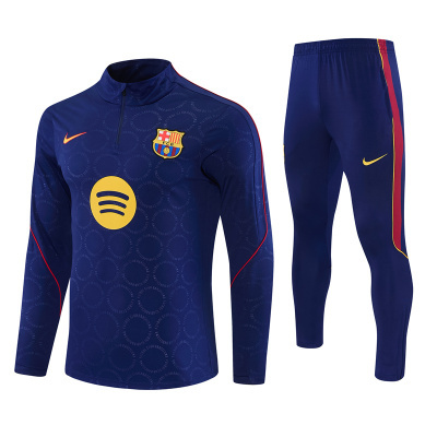 Conjunto de treino FC Barcelona azul escuro com logótipos e detalhes coloridos