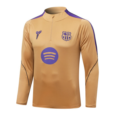 Camisola desporto manga comprida dourada com logos do FCB e Spotify roxos
