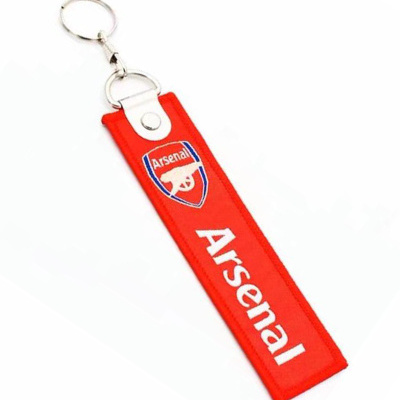 Chaveiro vermelho com logótipo e texto Arsenal