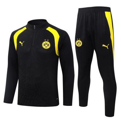 Conjunto desportivo preto e amarelo com logótipos Puma e BVB 09.