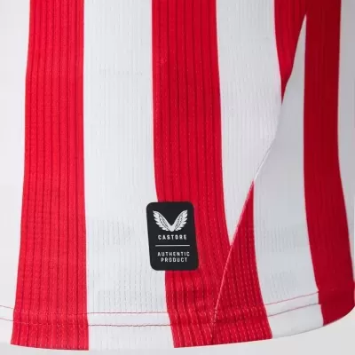 Parte inferior de camisola desportiva com riscas vermelhas e brancas e etiqueta Castore