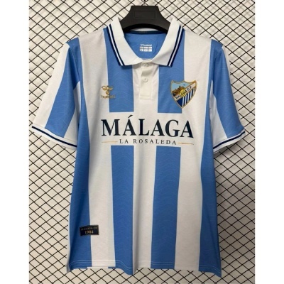 Camisola de futebol Málaga CF azul clara e branca com riscas verticais
