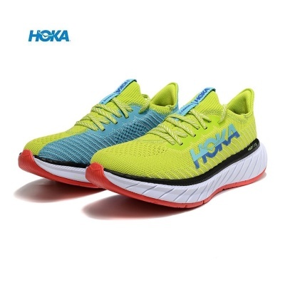 Sapatilhas desportivas HOKA azul e verde-limão com sola branca e detalhes laranja