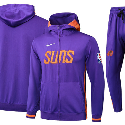 Conjunto desportivo roxo laranja com texto SUNS e logos Nike e NBA.