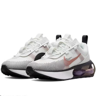 Sapatilhas desportivas Nike brancas com padrão de pontos pretos e logo rosa