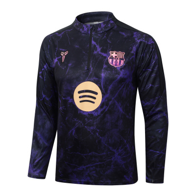Camisola desportiva preta e roxa do FC Barcelona com fecho e logos em rosa e amarelo.