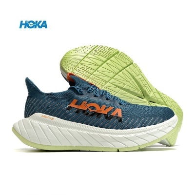 Ténis desportivos HOKA azul com sola grossa branca e verde clara
