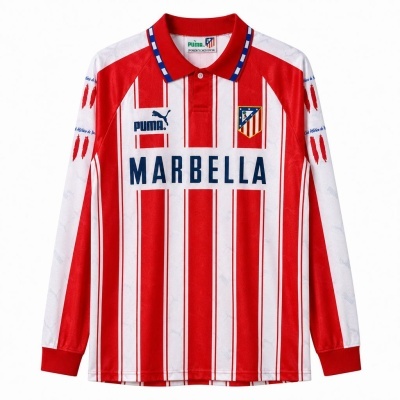 Camisola de futebol com riscas vermelhas e brancas e logótipos PUMA e Atlético de Madrid