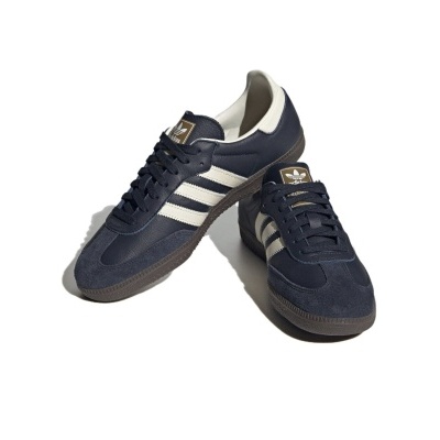 Sapatilhas Adidas azul escuro e branco com três riscas laterais e sola castanha