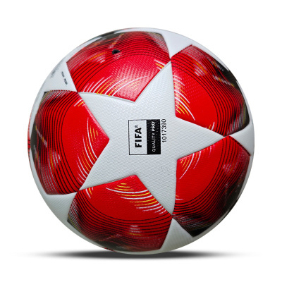 Bola de futebol branca e vermelha com texto FIFA QUALITY PRO