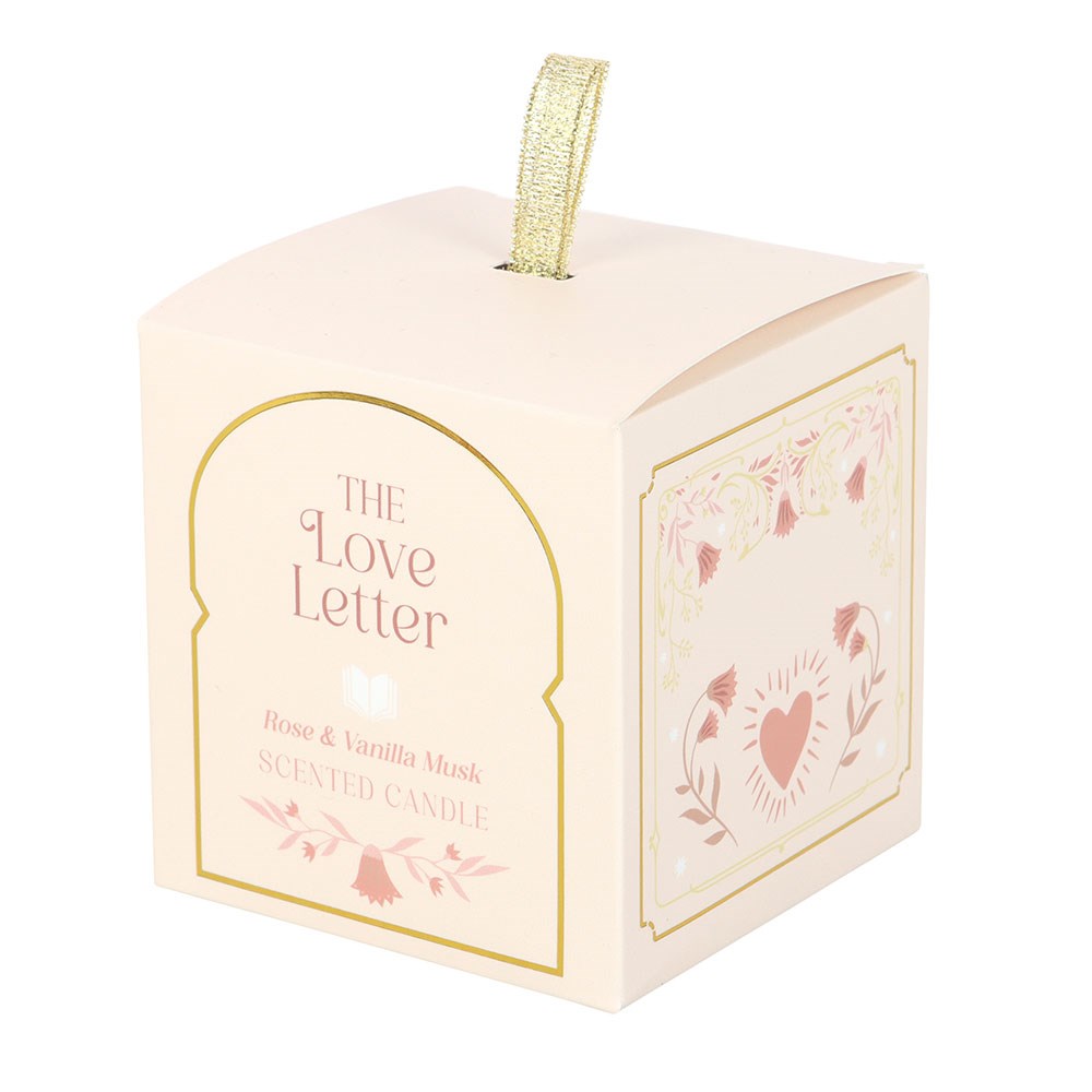 Caixa de vela perfumada rosa com detalhes florais e dourados