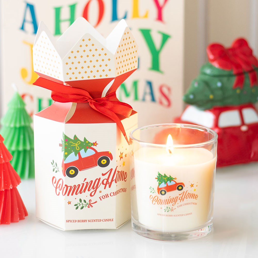Vela perfumada com design de Natal em recipiente de vidro com embalagem decorada