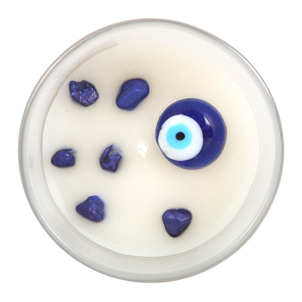 Vela branca em vidro com olhos turcos azuis decorativos