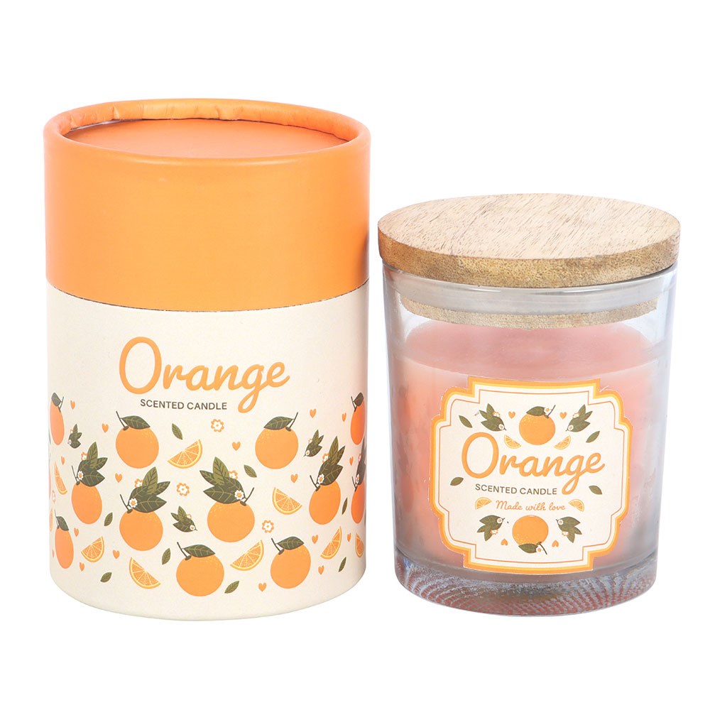 Vela perfumada de laranja em vidro com tampa de madeira e embalagem decorada