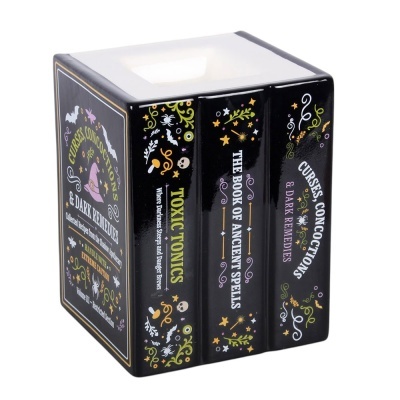 Conjunto de três livros decorativos pretos com símbolos mágicos coloridos