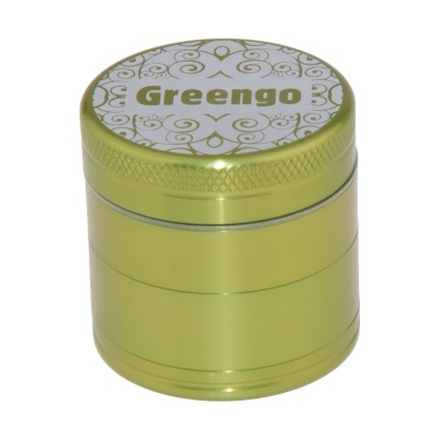 Recipiente metálico cilíndrico verde dourado com tampa branca decorada e texto Greengo