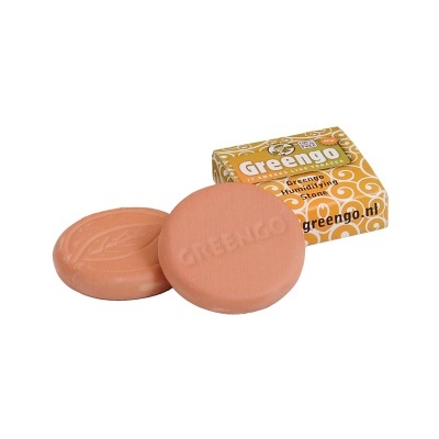 Discos de terracota laranja Greengo à frente de caixa amarela com texto